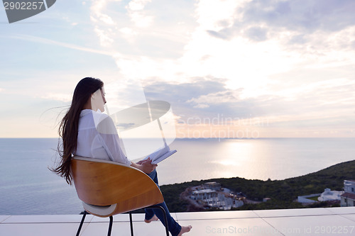 Image of relaxed young womant at home