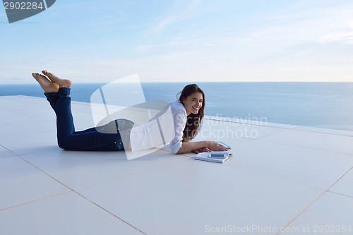 Image of relaxed young womant at home