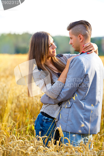 Image of Happy smiling young couple outdoor