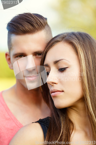Image of Happy smiling young couple outdoor