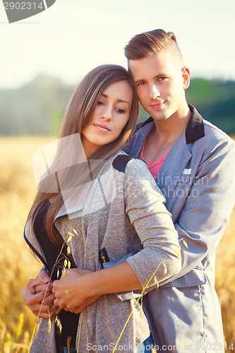 Image of Happy smiling young couple outdoor