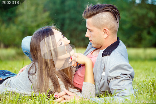 Image of Happy smiling young couple outdoor