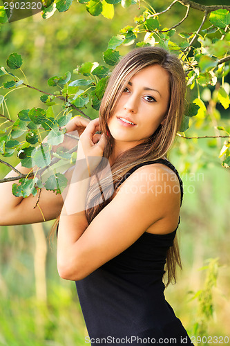 Image of Portrait of a charming lady woman girl outdoor