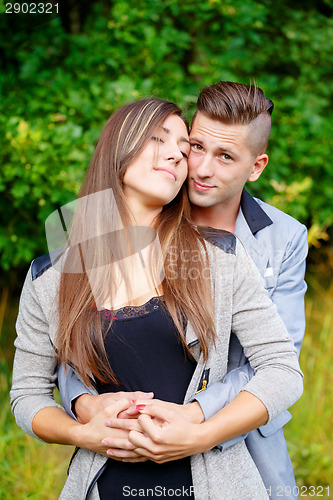 Image of Happy smiling young couple outdoor