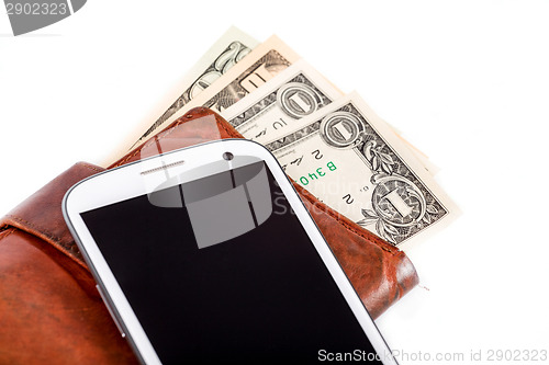 Image of cellphone and money on white