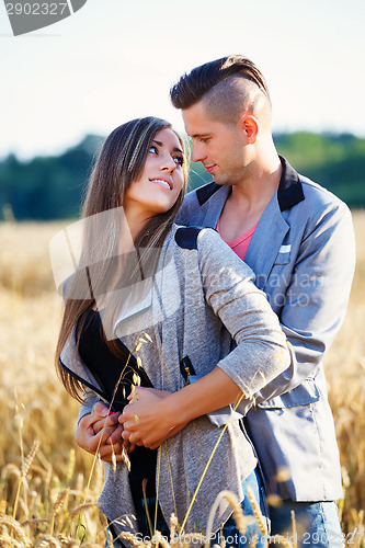 Image of Happy smiling young couple outdoor