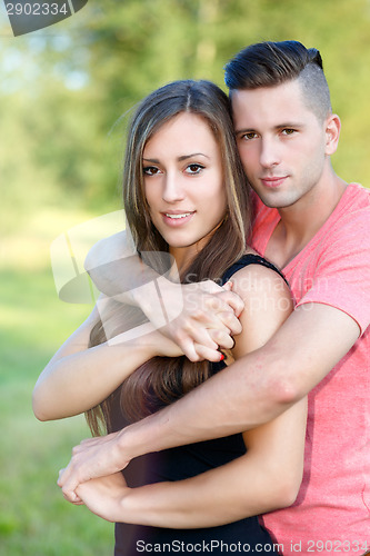 Image of Happy smiling young couple outdoor