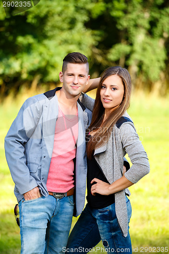 Image of Happy smiling young couple outdoor