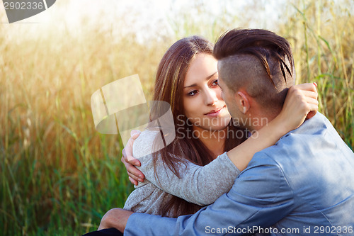 Image of Happy smiling young couple outdoor