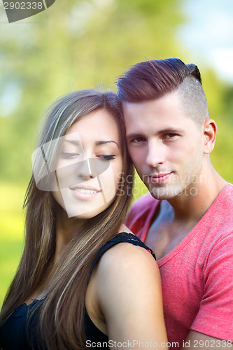 Image of Happy smiling young couple outdoor