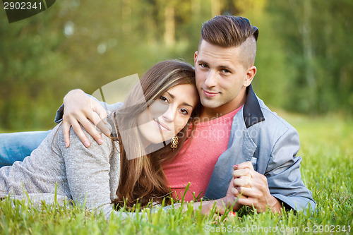 Image of Happy smiling young couple outdoor