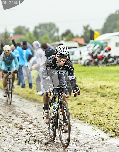 Image of The Cyclist Mark Renshaw on a Cobbled Road - Tour de France 2014