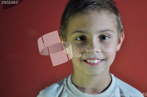 Image of portrait of excited smiling small boy