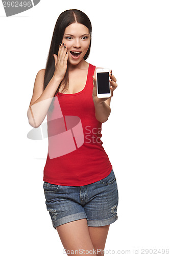 Image of Excited surprised woman showing cell phone