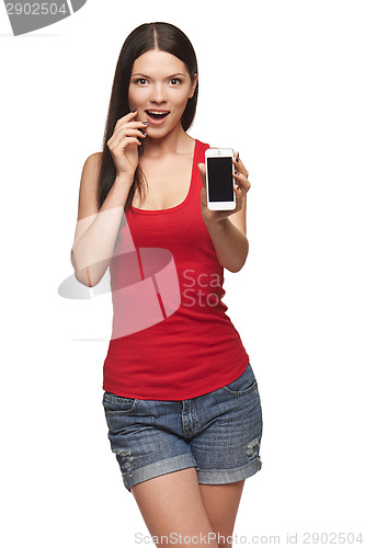 Image of Excited surprised woman showing cell phone