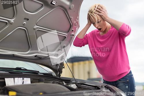 Image of Stressed Young Woman with Car Defect.