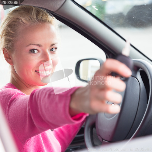 Image of Woman driver showing car keys.