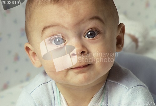 Image of Baby with wide eyes looking directly to camera