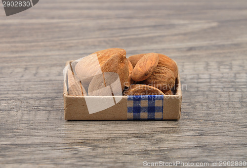Image of Almonds on wood