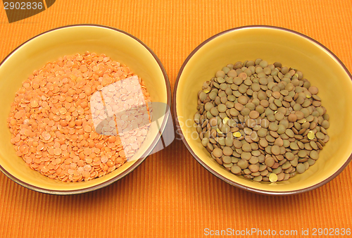 Image of Two bowls of ceramic with lentils and red lentils