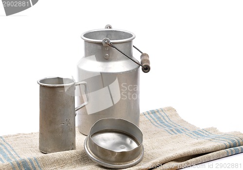 Image of Graduated jug and milk can