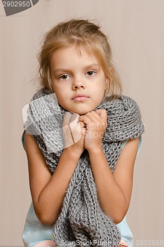 Image of Diseased five year old girl wrapped in a scarf