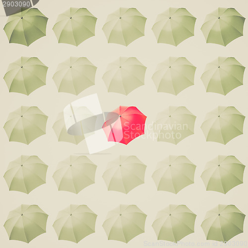 Image of Retro look Red umbrella among white