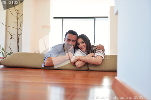 Image of relaxed young couple at home