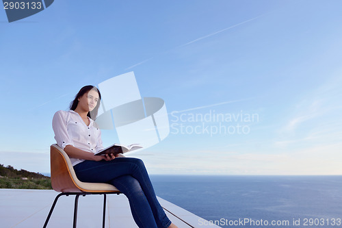 Image of relaxed young womant at home