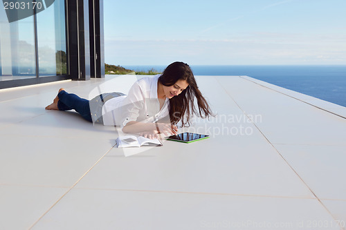Image of relaxed young womant at home