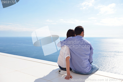 Image of relaxed young couple at home