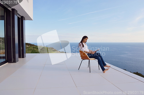 Image of relaxed young womant at home