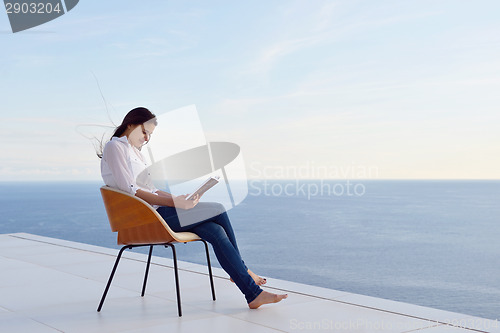 Image of relaxed young womant at home