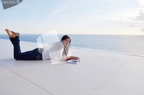 Image of relaxed young womant at home