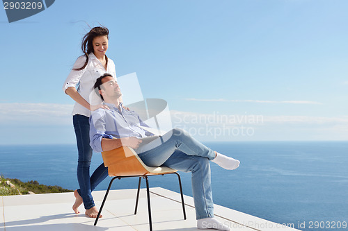 Image of relaxed young couple at home