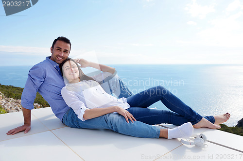 Image of relaxed young couple at home