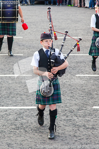 Image of ULLAPOOL, SCOTLAND - JULY 17: Bagpipes' parade at local Highland