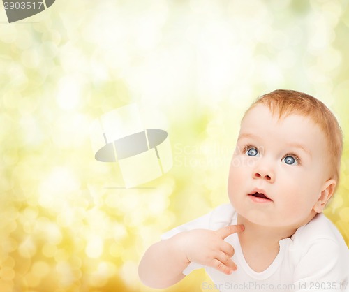 Image of curious baby looking up