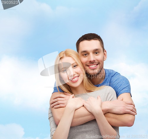 Image of smiling couple hugging