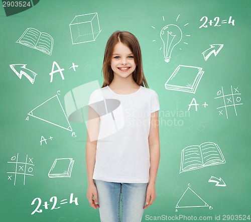 Image of smiling little girl in white blank t-shirt