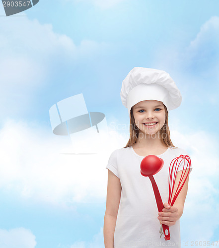 Image of smiling girl in cook hat with ladle and whisk