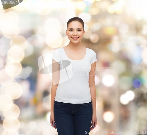 Image of smiling young woman in blank white t-shirt