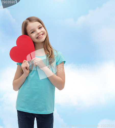 Image of smiling little girl with red heart