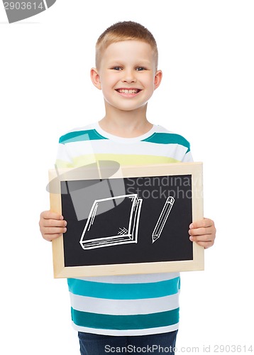 Image of smiling little boy with blank blackboard