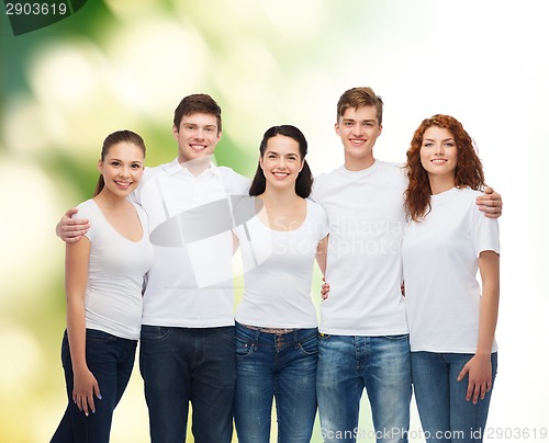 Image of group of smiling teenagers in white blank t-shirts