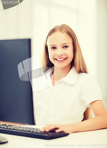 Image of student girl with computer at school