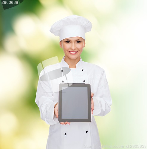 Image of smiling female chef with tablet pc blank screen