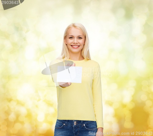 Image of smiling girl with blank business or name card