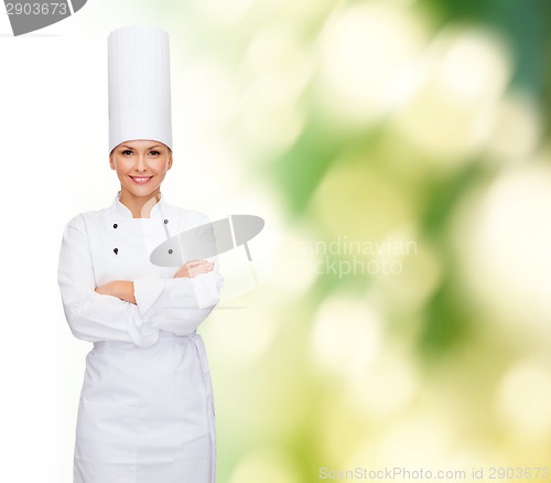 Image of smiling female chef with crossed arms