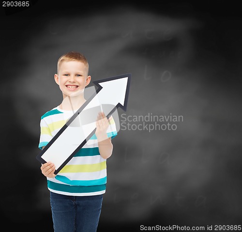 Image of smiling little boy with blank arrow pointing right